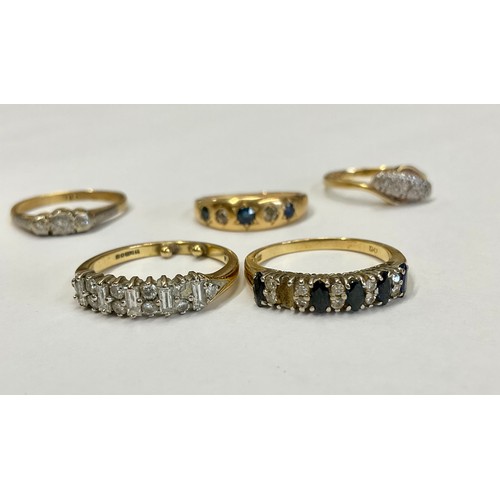 308 - An 18ct gold diamond ring set with five baguette cut stones, interspersed with brilliants, size J/K,... 