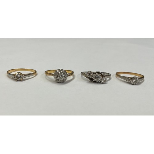 310 - An 18ct gold diamond solitaire ring, size K, marked 18ct, 1.6g; an 18ct gold diamond cluster ring, s... 