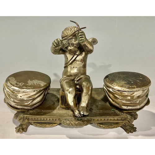 317 - A French silvered bronze inkstand, as an amorini flanked by drums, 19cm wide, early 20th century