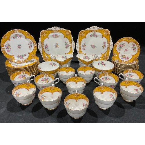 322 - A Paragon tea set, comprising pair of sandwich plates, twelve cups, saucers and tea plates, two set ... 