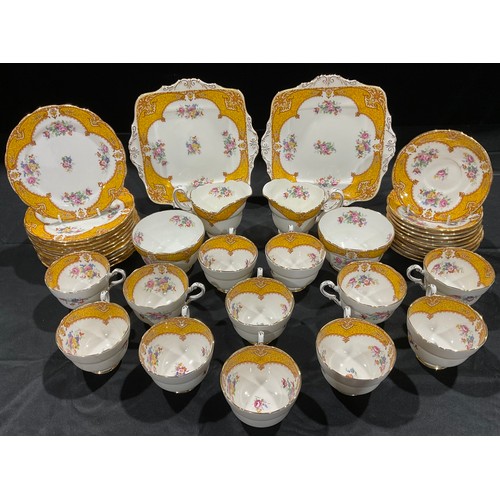 322 - A Paragon tea set, comprising pair of sandwich plates, twelve cups, saucers and tea plates, two set ... 