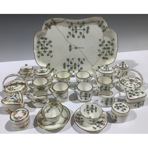 402 - A Mintons miniature tea service, decorated with cornflowers, comprising teapot, sucrier and cover, c... 