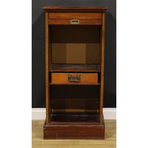 81 - An early 20th century mahogany tambour front pedestal cabinet, retractable door enclosing a single d... 