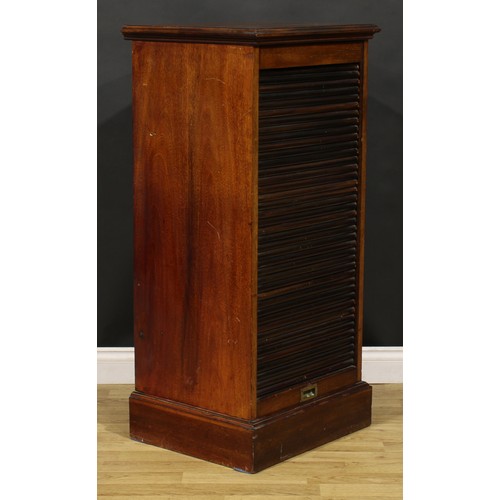 81 - An early 20th century mahogany tambour front pedestal cabinet, retractable door enclosing a single d... 