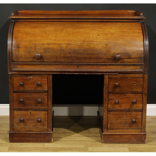 82 - A Victorian mahogany twin pedestal cylinder desk, retractable door enclosing a writing surface, smal... 