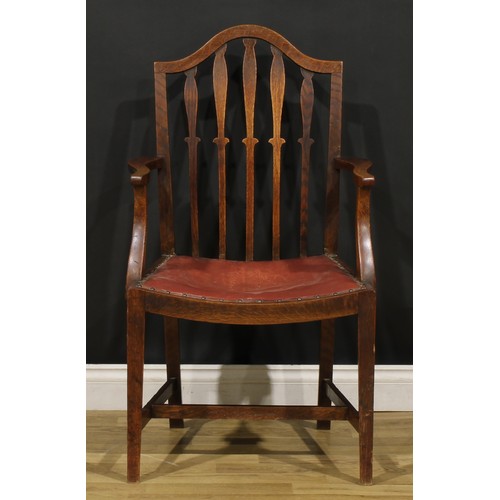 91 - A set of six early 20th century oak dining chairs, comprising four side chairs and a pair of carvers... 