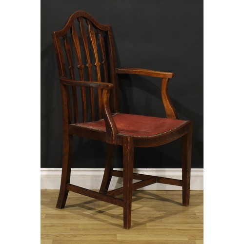 91 - A set of six early 20th century oak dining chairs, comprising four side chairs and a pair of carvers... 