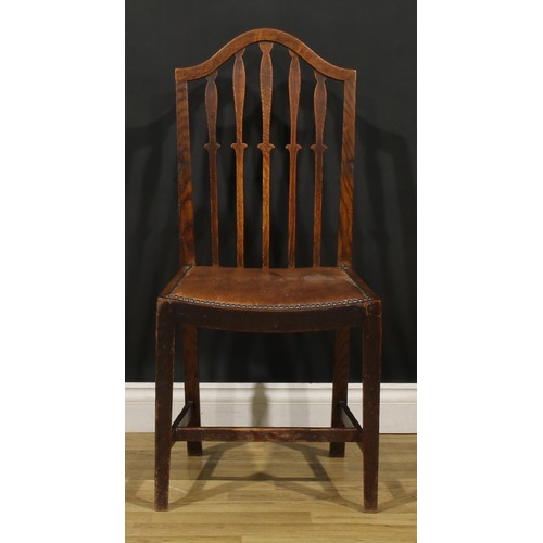 91 - A set of six early 20th century oak dining chairs, comprising four side chairs and a pair of carvers... 