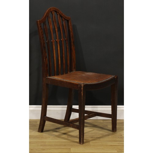 91 - A set of six early 20th century oak dining chairs, comprising four side chairs and a pair of carvers... 