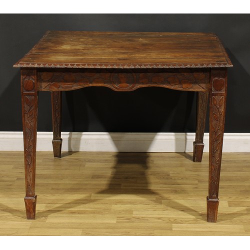 93 - An Arts & Crafts period oak table, rectangular top, the underframe carved throughout in the Art Nouv... 