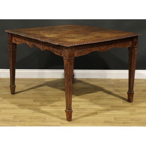 93 - An Arts & Crafts period oak table, rectangular top, the underframe carved throughout in the Art Nouv... 