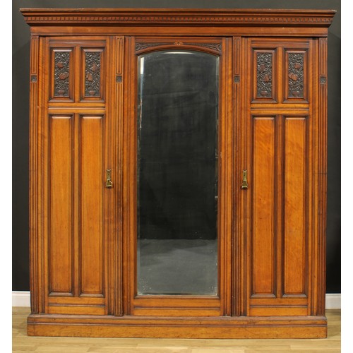 95 - A late Victorian Aesthetic Movement walnut wardrobe, by Druce & Co, badged, 220cm high, 211cm wide, ... 