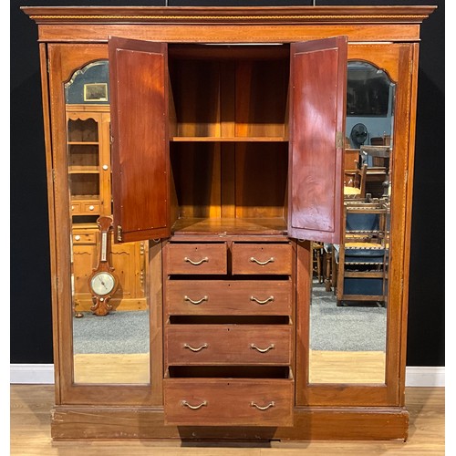 100 - An Edwardian Sheraton Revival mahogany and marquetry compactum wardrobe, 216cm high, 192cm wide, 61c... 