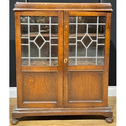 189 - A Jacobean Revival oak leaded glazed bookcase, 107cm high, 83cm wide, 26.5cm deep, c.1930