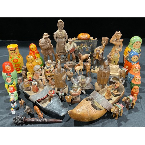 436 - Treen - a collection of Continental carved wooden figures and animals, including Black Forest bear v... 