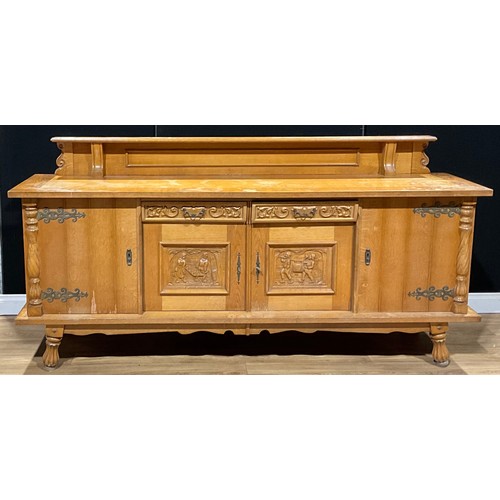 456 - A large Continental design oak buffet sideboard, the central door panels carved as 18th century styl... 