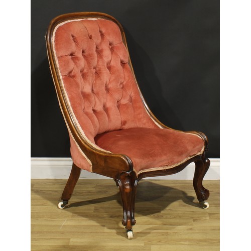 463 - A Victorian walnut drawing room chair, stuffed-over upholstery, cabriole forelegs, ceramic casters, ... 