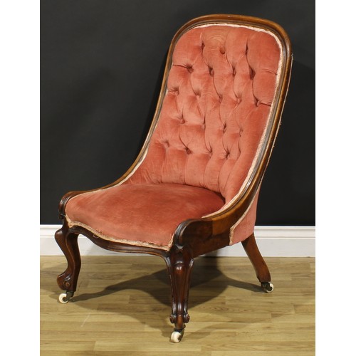 463 - A Victorian walnut drawing room chair, stuffed-over upholstery, cabriole forelegs, ceramic casters, ... 