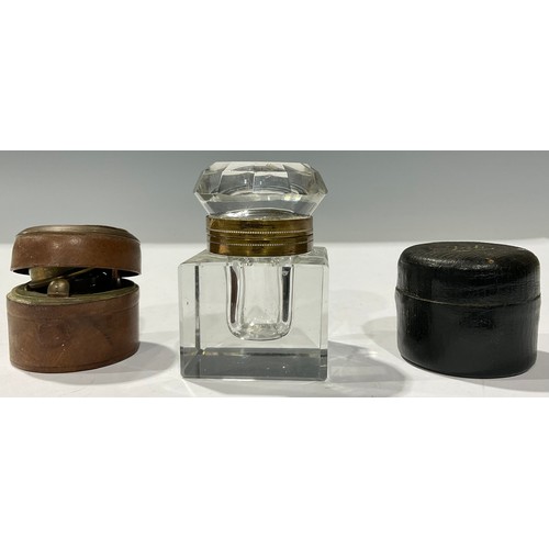 443 - Boxes & Objects - an early 20th century inkwell, chased brass lid, leather case; another similar; an... 