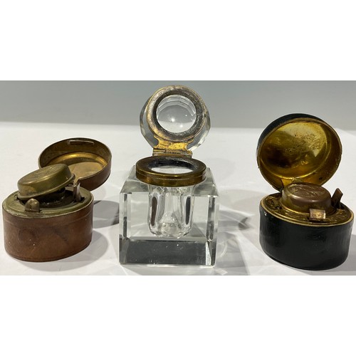 443 - Boxes & Objects - an early 20th century inkwell, chased brass lid, leather case; another similar; an... 