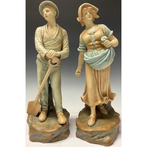 453 - A pair of Continental porcelain figures, Farm Girl and Boy, after Schoop, 35cm high