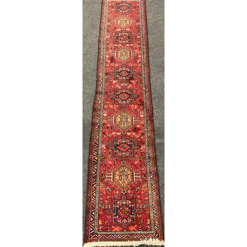 62 - An Indian ‘Gharade’ region hand-knotted runner carpet, 366cm x 75cm.