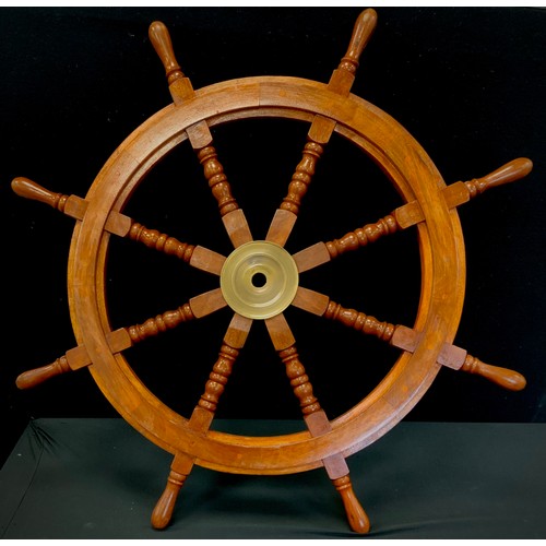 63 - A replica wooden ships wheel, 83cm high