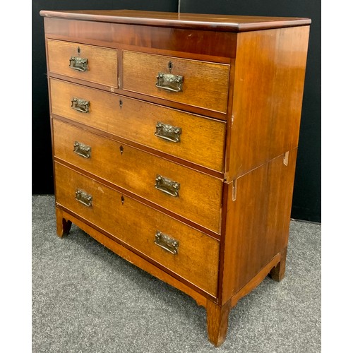 80 - A Victorian oak chest of drawers, mahogany veneered frieze, two short, over three graduated long, co... 