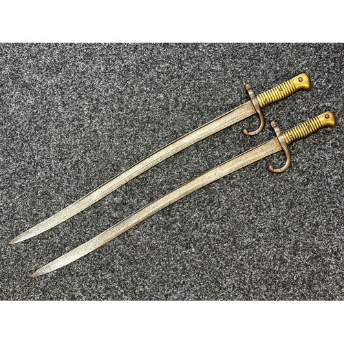 9064 - Pair of French 1866 Pattern Chassepot bayonets. One dated 1874, the other is unmarked. Both have wor... 