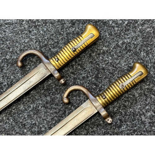 9064 - Pair of French 1866 Pattern Chassepot bayonets. One dated 1874, the other is unmarked. Both have wor... 