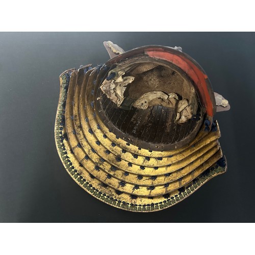 9075 - Japanese Samurai Kabuto Helmet with signature to front and signature to the interior. Red lacquer to... 