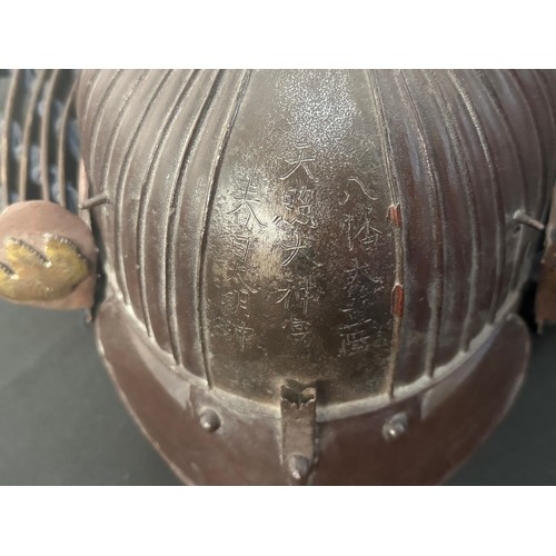 9075 - Japanese Samurai Kabuto Helmet with signature to front and signature to the interior. Red lacquer to... 