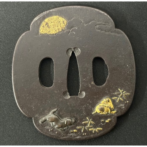 9089 - Japanese Sword Tsuba in bronze, unsigned, featuring two Dogs. Size 84mm x 77mm.