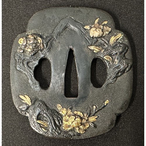 9092 - Japanese Sword Tsuba in bronze, unsigned, featuring Komainu Lion-dogs and Flowers, size 73mm x 68mm.