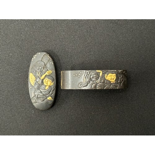 9098 - Japanese Sword Kashira and matching design Fuchi. Signed. (2)