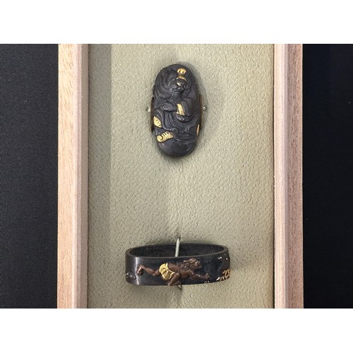 9105 - Japanese Sword Kashira and Fuchi in a wooden display box. Unsigned.