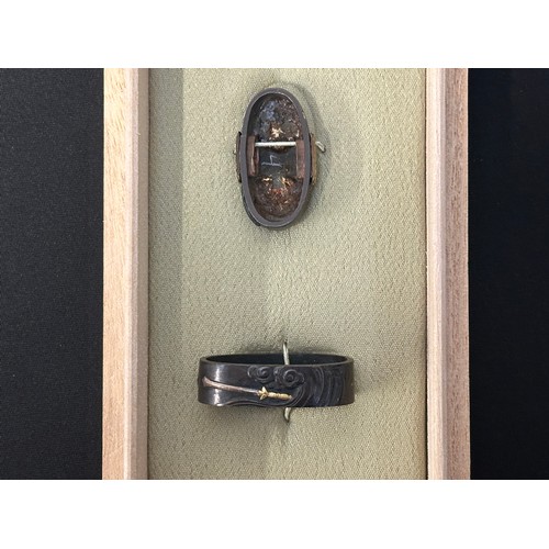 9105 - Japanese Sword Kashira and Fuchi in a wooden display box. Unsigned.