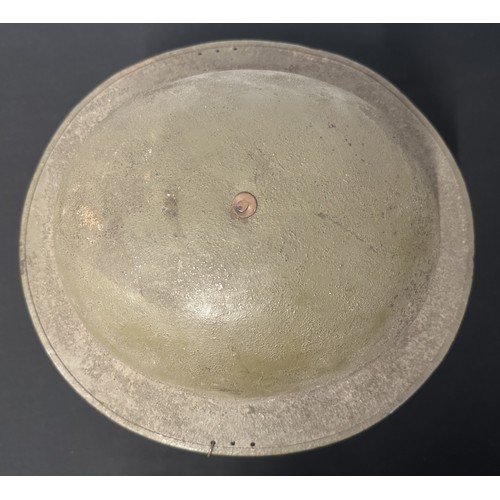 9116 - WW1 US M1917 Steel Helmet. Three holes have been drilled to each side of the rim to allow fitment of... 