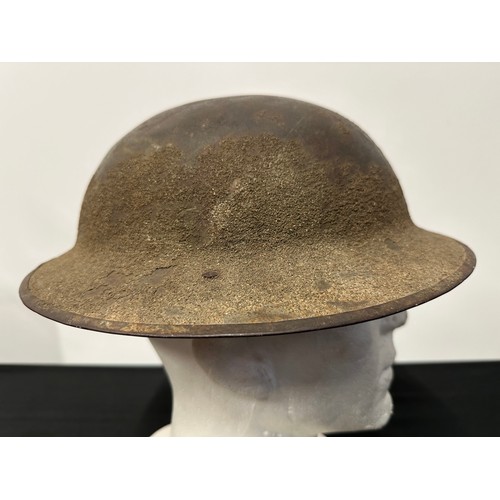 9117 - WW1 British Steel Helmet with original paint. Rim is Heat Treatment Lot number FS101. Complete with ... 