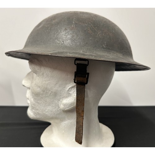 9118 - WW1 British Steel Helmet complete with liner and remains of the original leather chinstrap. Dark gre... 