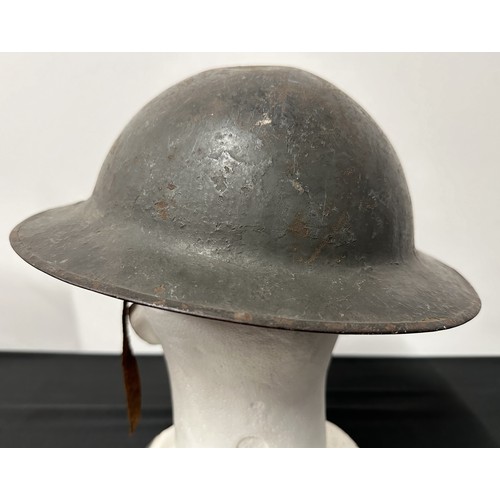 9118 - WW1 British Steel Helmet complete with liner and remains of the original leather chinstrap. Dark gre... 