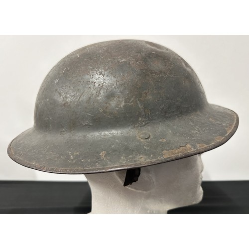 9118 - WW1 British Steel Helmet complete with liner and remains of the original leather chinstrap. Dark gre... 