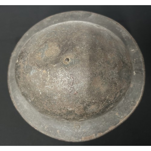 9118 - WW1 British Steel Helmet complete with liner and remains of the original leather chinstrap. Dark gre... 