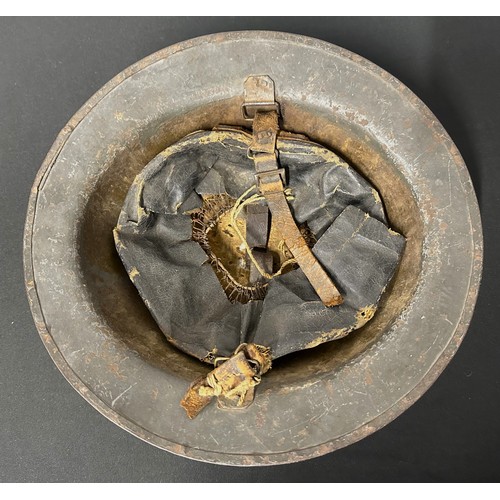 9118 - WW1 British Steel Helmet complete with liner and remains of the original leather chinstrap. Dark gre... 