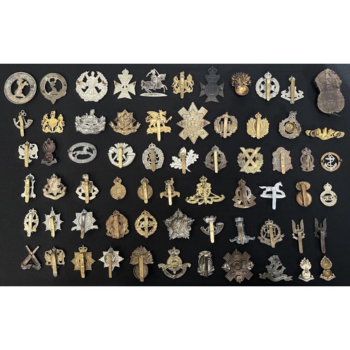 9191 - WW2 British Cap Badge collection comprising of over 60 badges and collar dogs.