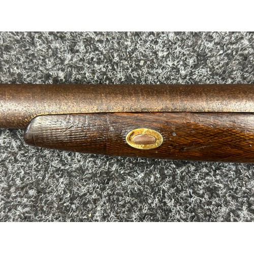 9323 - A single barrel percussion cap shotgun with 825mm long barrel. Bore approx. 23mm. Action holds at bo... 