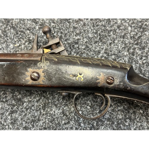 9329 - North African Flintlock Musket with 127cm long barrel. Bore approx. 15mm. Working action which holds... 