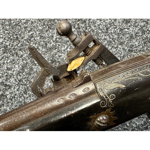 9329 - North African Flintlock Musket with 127cm long barrel. Bore approx. 15mm. Working action which holds... 