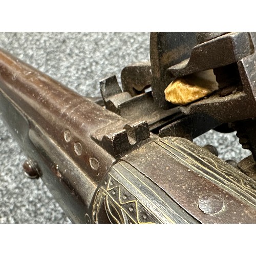 9329 - North African Flintlock Musket with 127cm long barrel. Bore approx. 15mm. Working action which holds... 