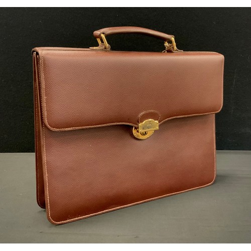 255 - Burberry brown leather briefcase, interlined Burberry material, fitted interior with pockets and com... 